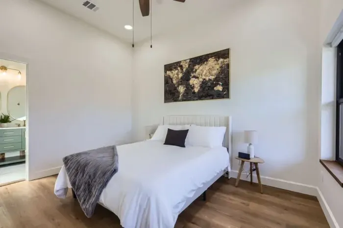 Featuring a plush bed and soothing color palette, this room is a serene escape from the world.