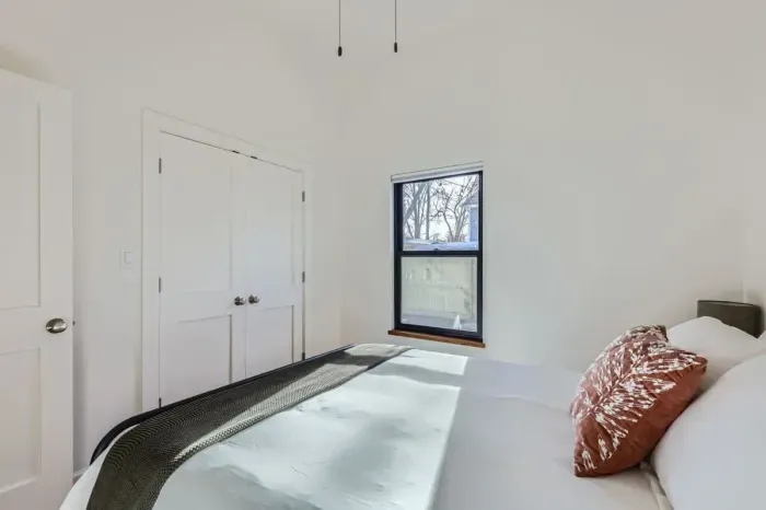 Serene bedroom with calming colors and thoughtfully chosen furnishings.