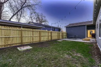 Serene backyard with a patio, ideal for dining al fresco or unwinding under the stars