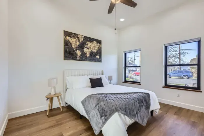 Spacious bedroom with a queen-sized bed and an en-suite bathroom