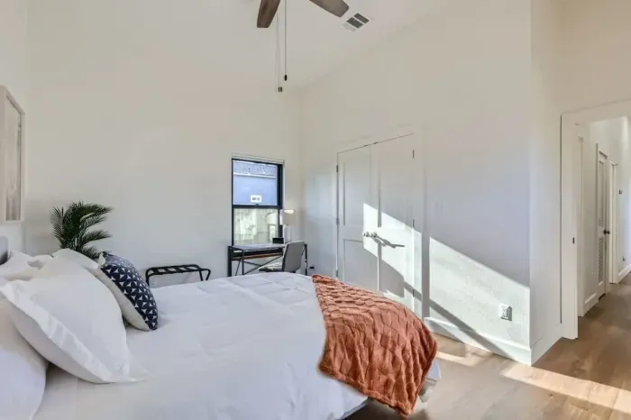 Thoughtfully designed with comfort in mind, this bedroom offers a seamless blend of warmth and sophistication.