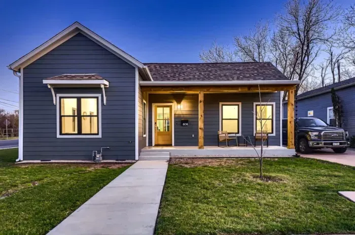 Charming exterior with a welcoming front porch and beautifully landscaped yard.