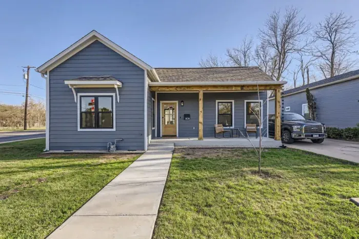 Charming exterior with a welcoming front porch and beautifully landscaped yard.