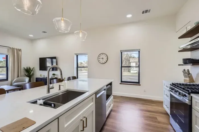A bright, open-concept kitchen flows seamlessly into the dining area for effortless entertaining.
