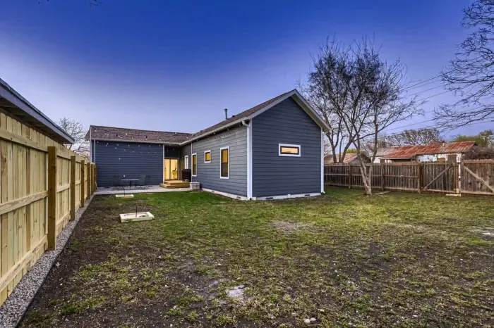 Spacious lawn with ample room for outdoor activities like frisbee, soccer, or yoga.