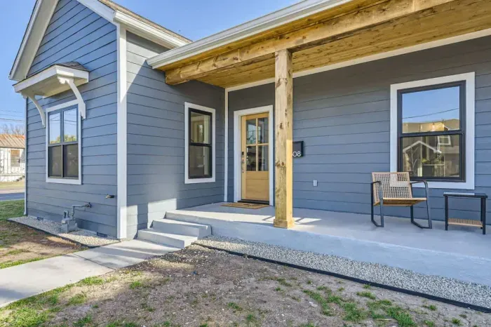 Inviting facade with a cozy front porch and stylish details.