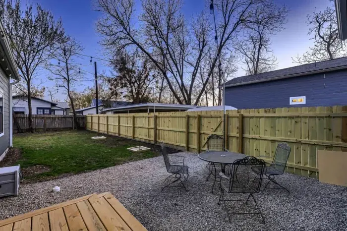 Serene backyard with a patio, ideal for dining al fresco or unwinding under the stars.