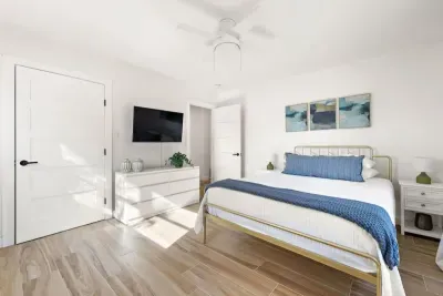 Guest-friendly bedroom with a cozy vibe and ample storage space.