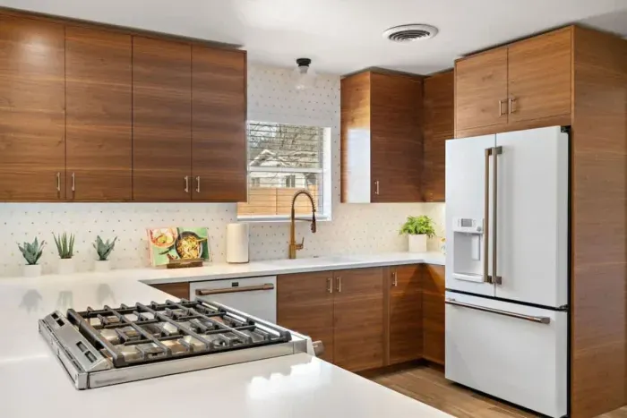 Another angle of the modern kitchen showing ample counter space and storage.