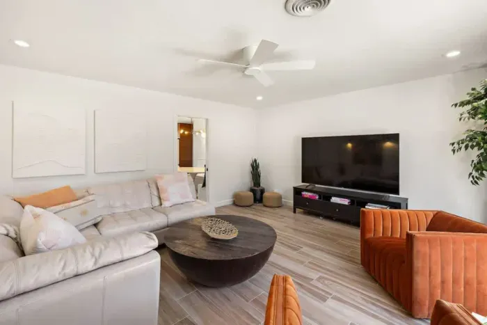 Spacious living area with comfortable couches, perfect for gathering with friends and family.