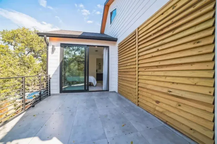 Inviting patio with a beautiful greenery, creating a serene outdoor retreat.