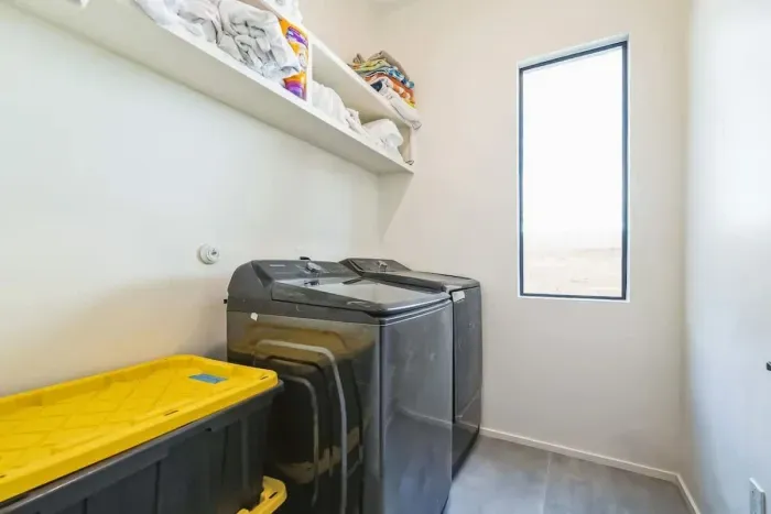 Convenient laundry area with a washer and dryer, making packing a breeze.