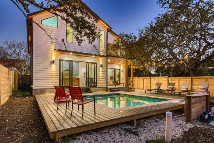 Whether it's a peaceful swim or a lively pool party, this backyard has it all!