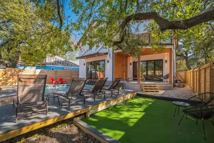 Escape the hustle and bustle in our backyard paradise, where the pool beckons you to relax.