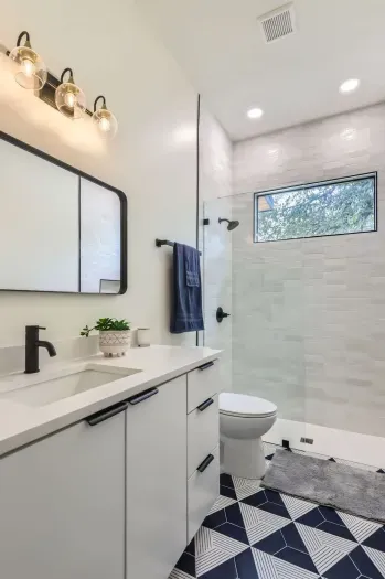 Unwind in our spacious bathroom with modern amenities and a touch of luxury.