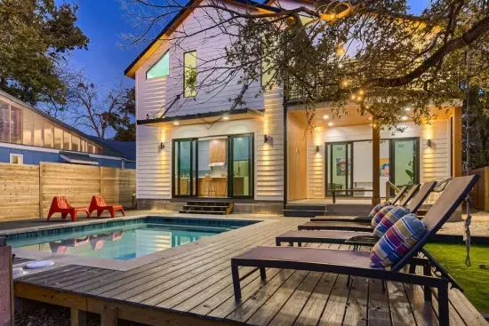 1. Step into luxury at this stunning modern retreat, designed for comfort and style! Featuring a private pool, spacious deck, and glowing outdoor ambiance, this home is perfect for relaxing evenings and unforgettable gatherings.