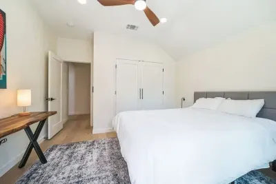 Bright and cheerful bedroom with a large bed and plenty of natural light.
