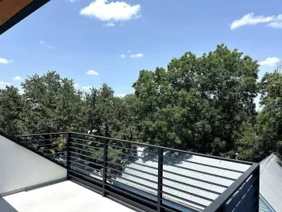 Peaceful patio surrounded by greenery, offering a serene space to relax or entertain.
