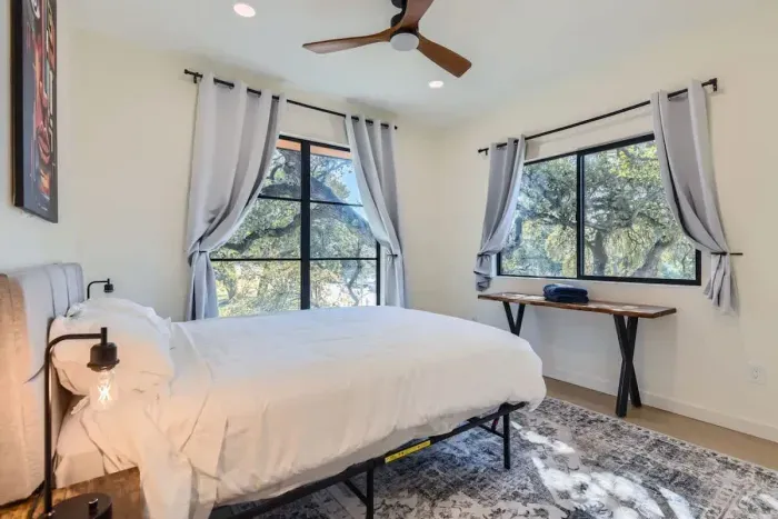 Bright and cheerful bedroom with a large bed and plenty of natural light.