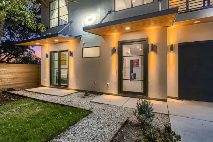 Well-maintained backyard with a variety of trees and shrubs for a natural, private setting.