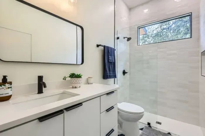 Unwind in our spacious bathroom with modern amenities and a touch of luxury.
