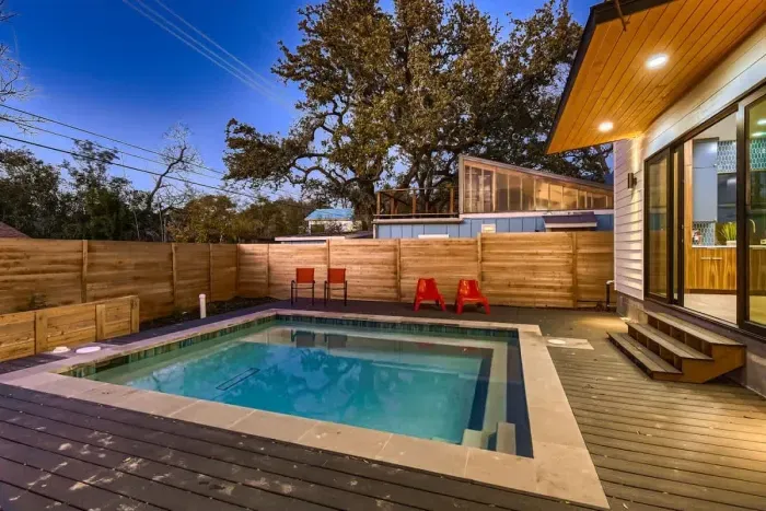 Escape the hustle and bustle in our backyard paradise, where the pool beckons you to relax.