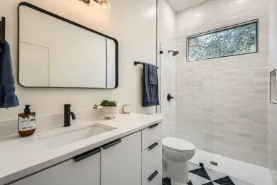 Unwind in our spacious bathroom with modern amenities and a touch of luxury.