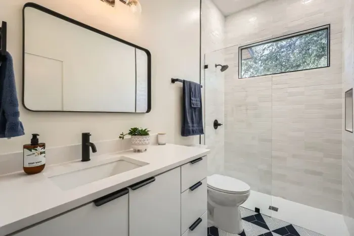 Unwind in our spacious bathroom with modern amenities and a touch of luxury.