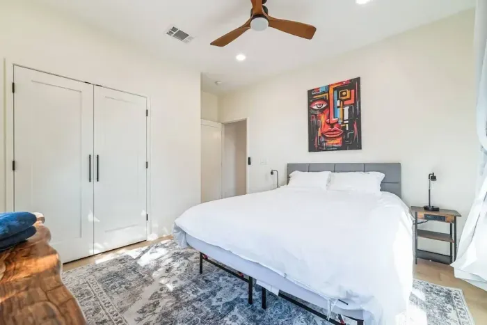 Featuring a beautifully dressed queen-size bed and soft lighting, this room is ideal for couples seeking a romantic retreat.