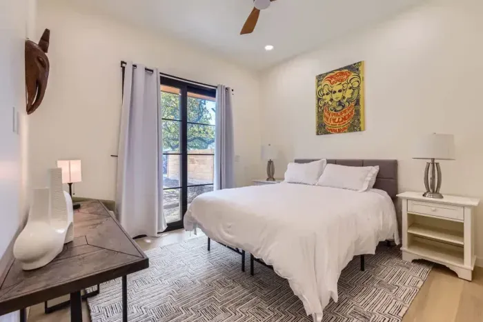 Featuring a beautifully dressed queen-size bed and natural lighting, this room is ideal for couples seeking a romantic retreat.