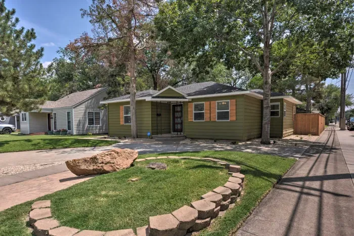 Front exterior of the home with charming landscaping.