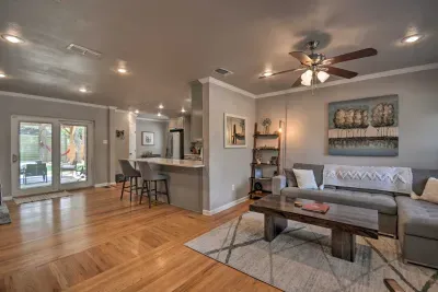 Spacious living room with wood floors and plenty of natural light.
