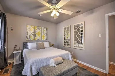 Another guest bedroom with soft bedding and natural light.