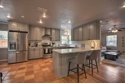 Modern kitchen with stainless steel appliances and ample counter space.