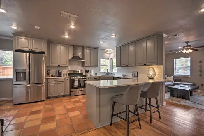 Modern kitchen with stainless steel appliances and ample counter space.