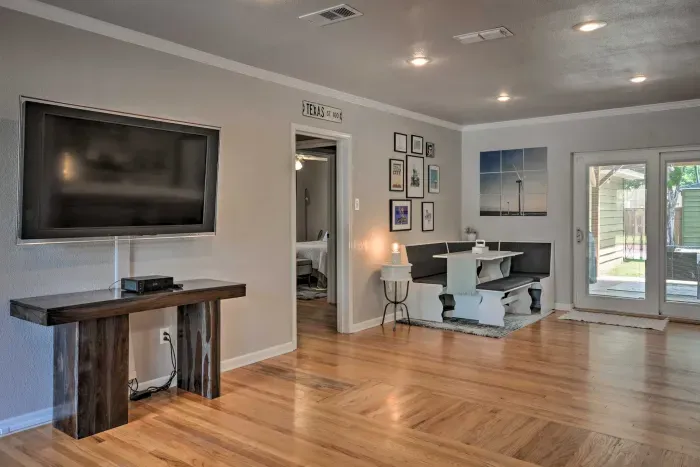 Living room with flat-screen TV and cozy seating for movie nights.