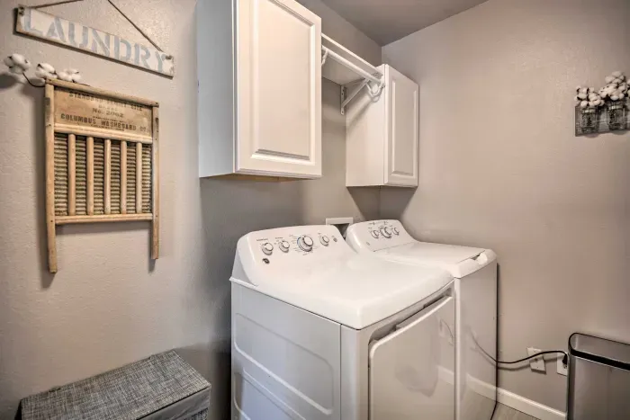 Laundry area with washer and dryer for guest use.