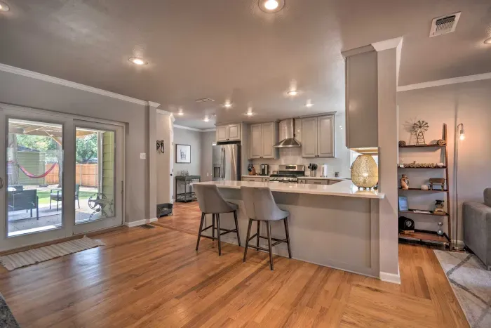 Open living and kitchen space with hardwood floors.