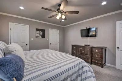 Another angle of the bedroom with TV and dresser.