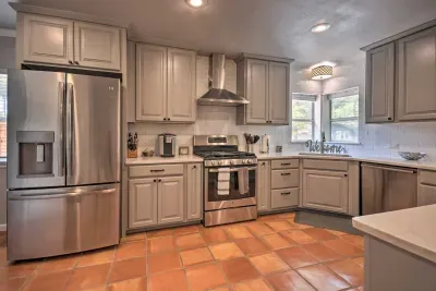 Bright kitchen featuring updated finishes and farmhouse sink.