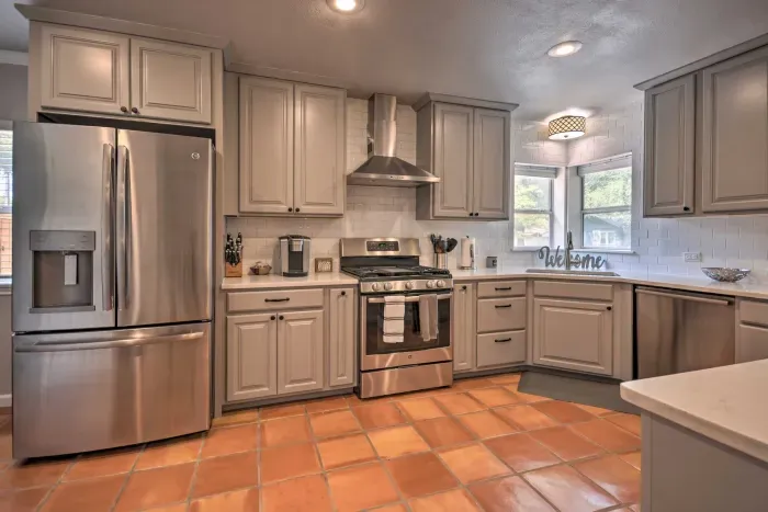 Bright kitchen featuring updated finishes and farmhouse sink.