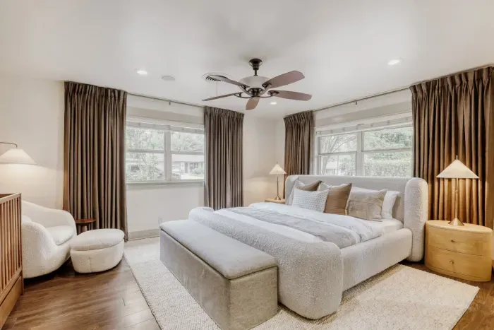 Serene primary suite with soft textures, warm tones, and abundant natural light… designed for true relaxation