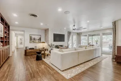 Spacious living area with a relaxed, modern feel, anchored by natural light and designed for effortless lounging