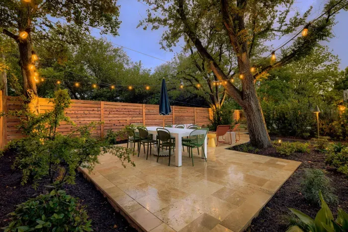 Private backyard dining with café lights, ideal for evening gatherings