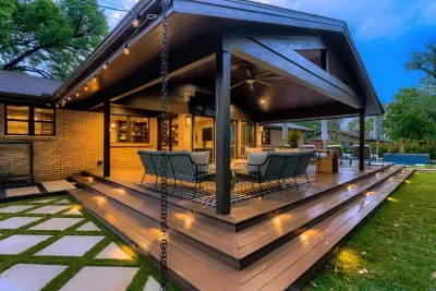Designed for connection… spacious covered deck with layered seating and views of the pool beyond