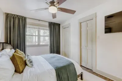 Cozy, light-filled bedroom with soft textures and calming tones creating a perfect space to unwind