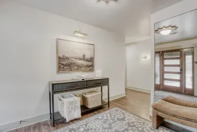 Welcoming entryway with clean lines and warm finishes, setting the tone for the rest of the home