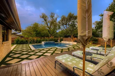 Clean lines and lush landscaping frame this private pool retreat making it perfect for sunny afternoons and quiet evenings
