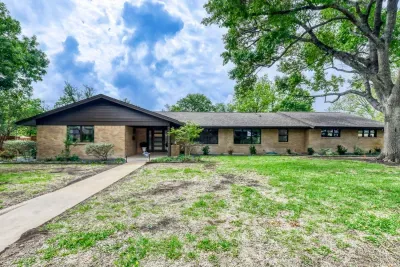 Charming single-story home with modern updates, mature trees, and a welcoming front entry.
