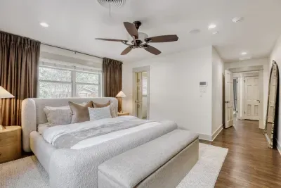 Spacious bedroom retreat with clean lines and a calming palette, offering a peaceful escape at the end of the day